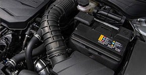 Car engine compartment showing the battery